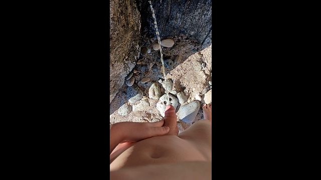 Nude Beach Guy Peeing Outdoors