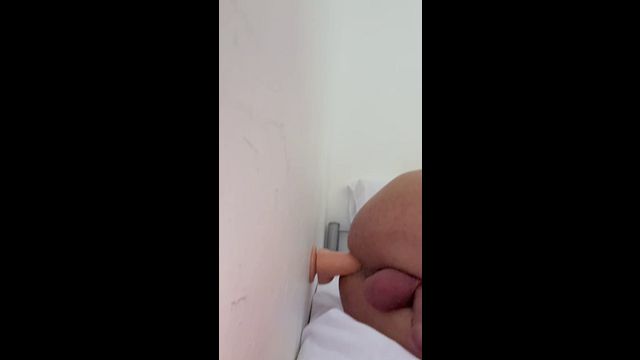 Gay Guy Tries New Position with Dildo in Bed