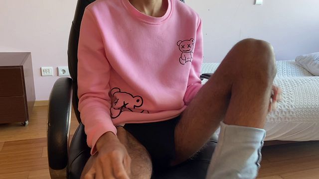 A young guy in jeans gets a hard-on and jerks off on cam.