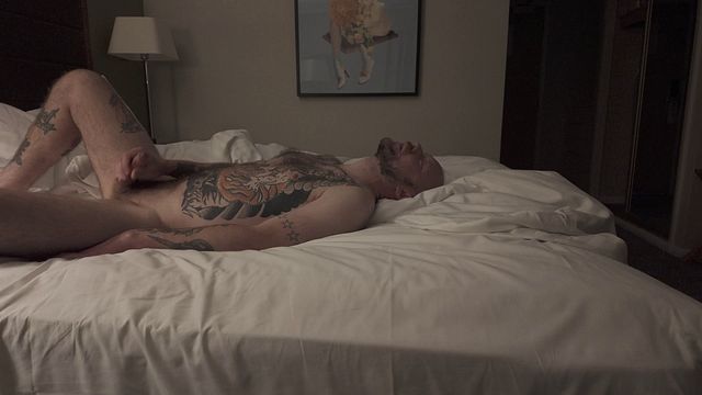 Tattooed solo DILF plays with cock and cums all over himself