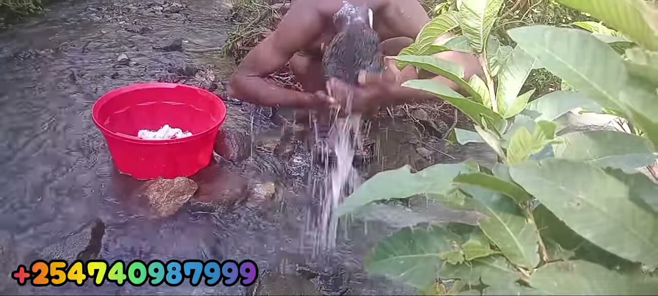 African Twink Bathes Naked in River