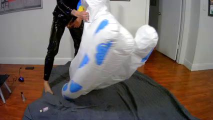 Latex Catsuit Guy Rides Inflatable Toy to Orgasm