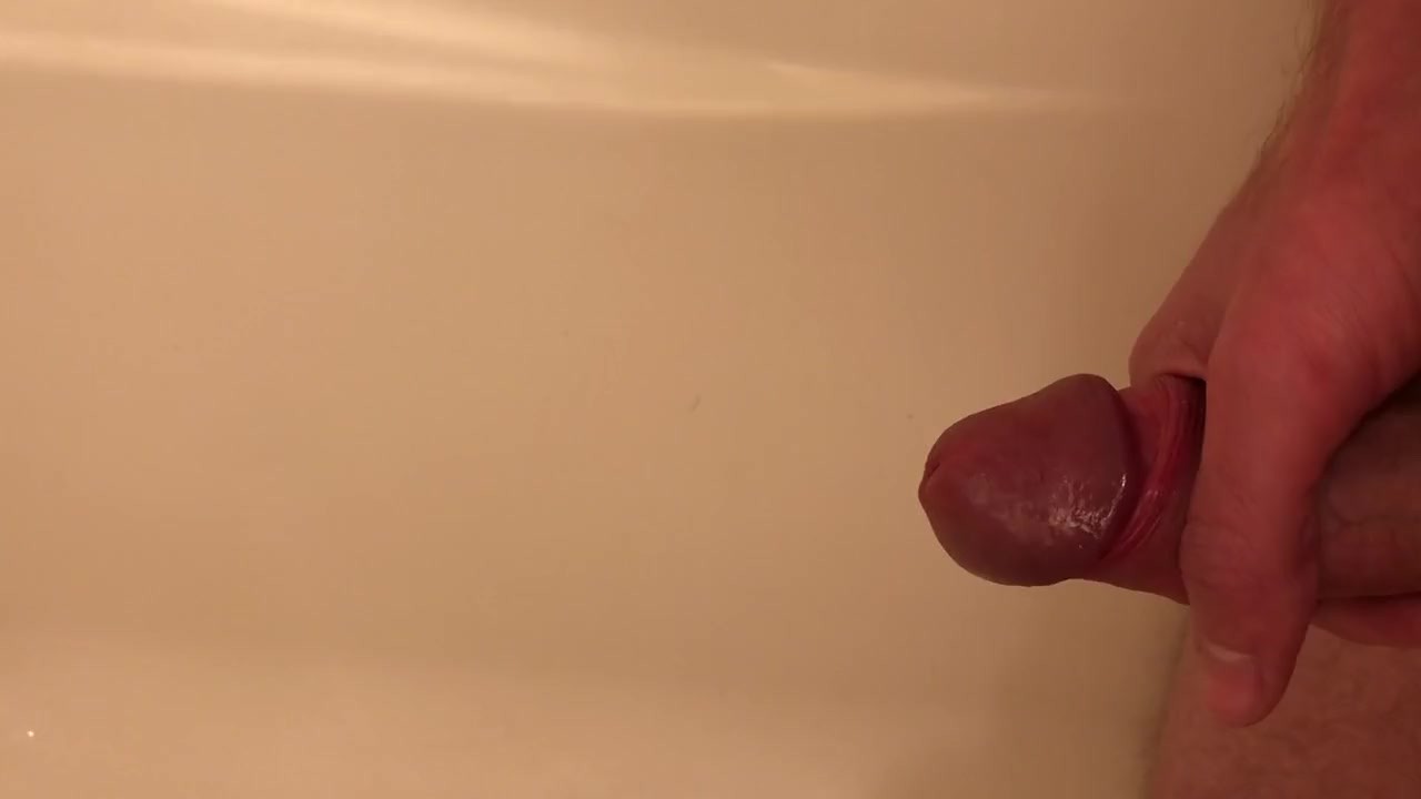 Guy Pisses in Tub, Jerks Off to Cum