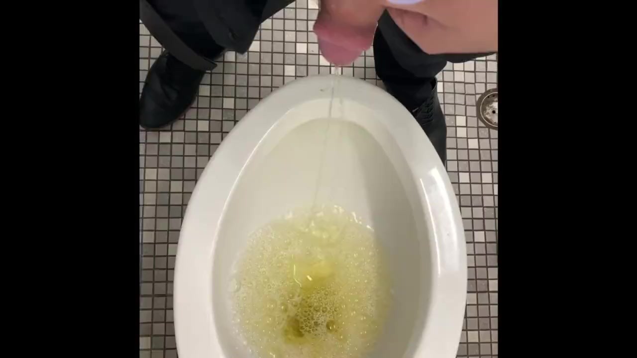 Guy Urinates in Public Restroom