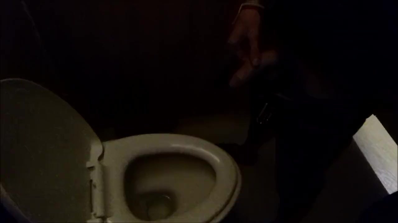 Man Urinates in Public Restroom