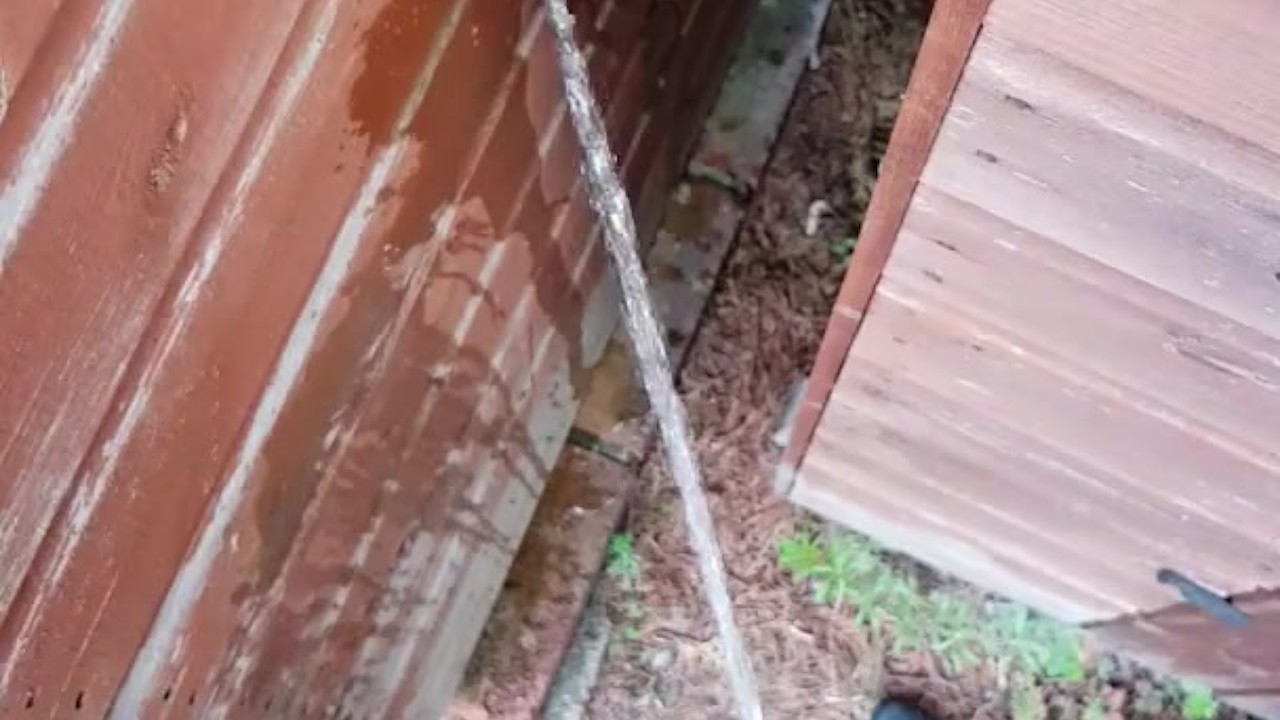 Guy Pisses Behind Shed in Work Trousers